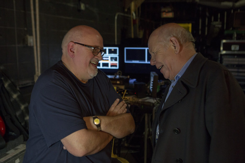 Pete Townshend guitar tech Alan Rogan chats with onstage sound engineer Bob Pridden prior to The Who and Elvis Costello and the Imposters performing at Madison Square Garden Theatre for Teen Cancer America.